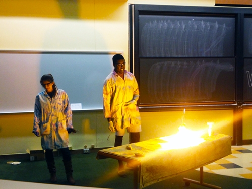 Jacques Bazile '16 and Sarah Briggs '16 use liquid oxygen to burn the sugar in a cookie