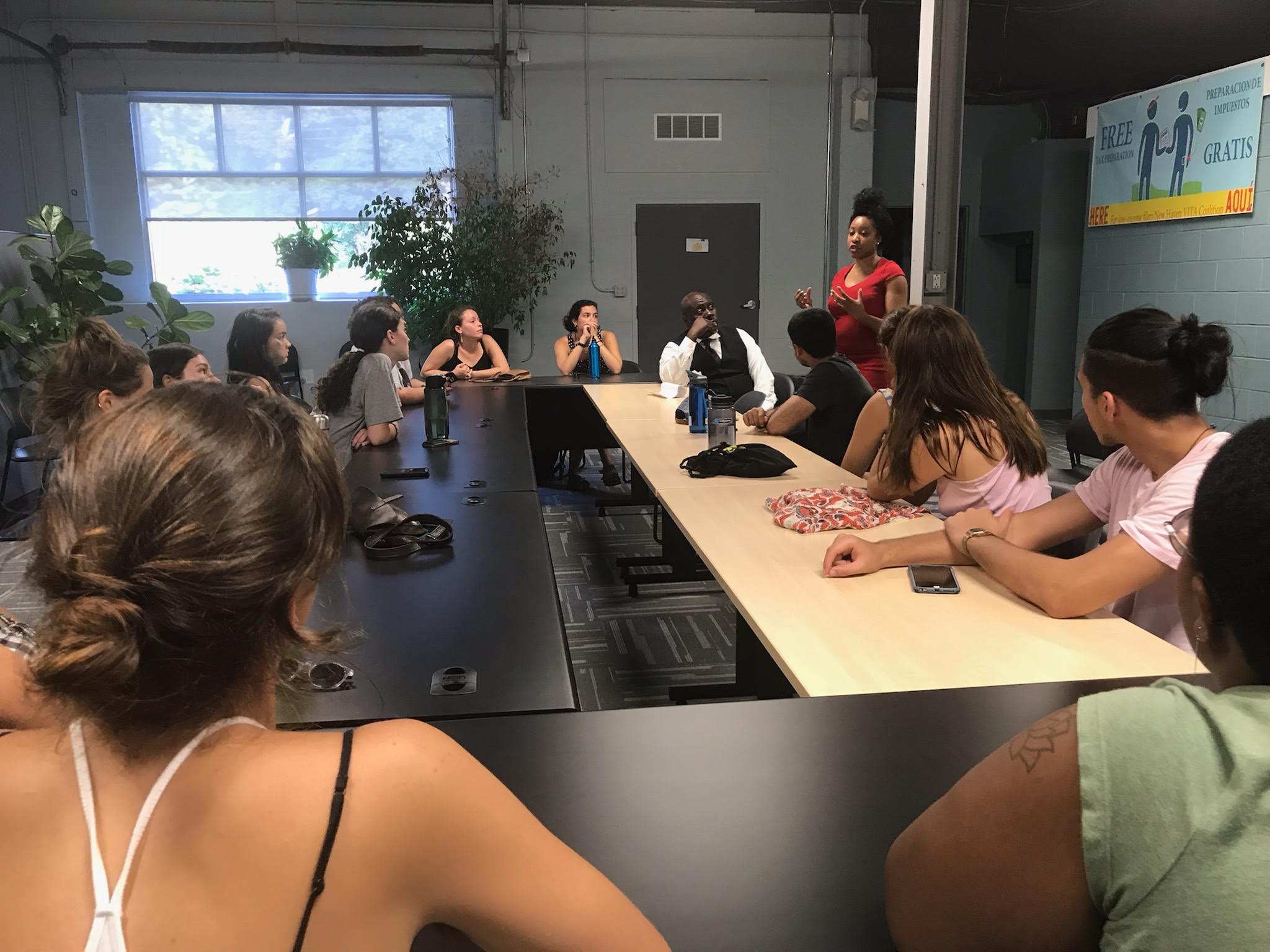 Students sitting and listening to a guest speaker. 