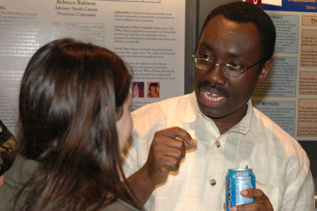 Prof. Henry Danso speaking with Rebecca Littman