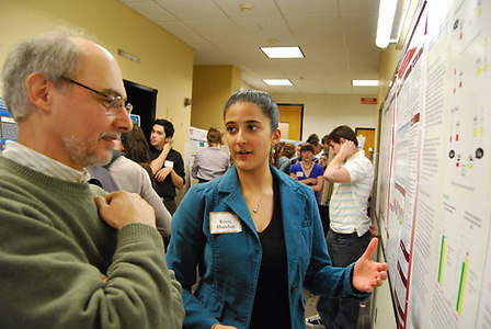 Graduate student Keera Bhandari talks to John Seamon, Prof. of Psychology and Prof. of Neuroscience and Behavior, about her study on preschoolers.