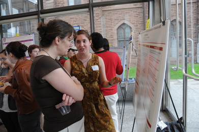 Melanie Bronfeld explaining her research, "The Relationship between Self-Esteem and Symptoms in Patients with Schizophrenia," to the chair of the Psychology Department, Prof. Lisa Dierker