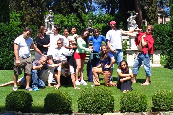 Molly Gaebe, in Florence, Italy in the summer ’06 at the Commedia dell’Arte: The Actor as Creator, Clown, Poet program. Molly (second from left, standing) and the entire class posing on the stage.