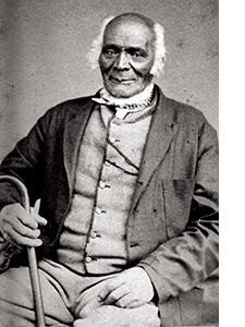 Early American black man posing for photograph