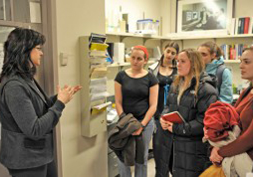 Professor Jan Naegele of the Department of Biology discusses her research with undergraduates as part of the WesWIS Lab Tour Program.